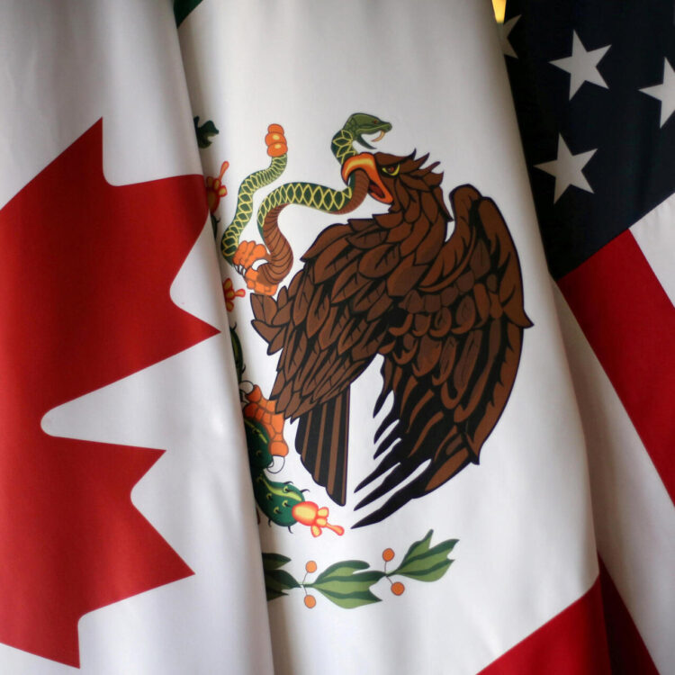 FILE PHOTO: Flags are pictured during the fifth round of NAFTA talks involving the United States, Mexico and Canada, in Mexico City, Mexico, November 19, 2017.  REUTERS/Edgard Garrido/File Photo