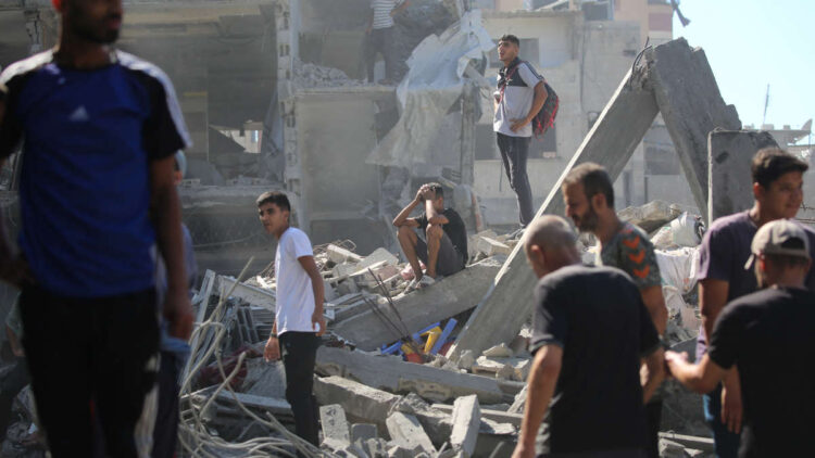 Palestinians inspect the damage after an Israeli strike in the Al-Bureij camp in the central Gaza Strip on July 4, 2025. (Photo by Eyad BABA / AFP)